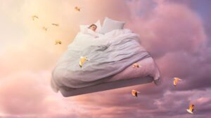 Um pessoa dormindo em uma cama que sobe voando com pássaros